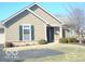 Lovely exterior of home with green shutters, landscaped yard, and a paved driveway at 515 Bridgestone Dr, Mooresville, IN 46158