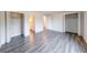 Spacious bedroom with plank flooring and ample closet space with bi-fold doors at 5525 Roxbury Ter, Indianapolis, IN 46226