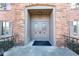 Inviting front entrance with elegant double doors and brick surround at 5525 Roxbury Ter, Indianapolis, IN 46226