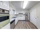 Bright kitchen with white cabinets and stainless steel appliances at 5525 Roxbury Ter, Indianapolis, IN 46226