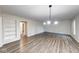 Well-lit living room with modern lighting, and built-in shelves at 5525 Roxbury Ter, Indianapolis, IN 46226