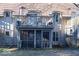 Rear exterior with a screened in porch and open deck; perfect for outdoor entertainment at 5525 Roxbury Ter, Indianapolis, IN 46226