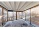 Charming screened porch with a view of the landscaped backyard at 5525 Roxbury Ter, Indianapolis, IN 46226