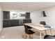 Basement recreation room with custom cabinets, wet bar, and a table for board games at 5537 Broadway St, Indianapolis, IN 46220