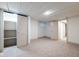 Finished basement featuring a closet, lighting, and neutral carpeting at 5537 Broadway St, Indianapolis, IN 46220