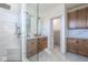 Bathroom featuring a glass shower, vanity, and built-in storage cabinets at 5537 Broadway St, Indianapolis, IN 46220