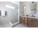 Modern bathroom with a glass-enclosed shower and double vanity with sleek fixtures at 5537 Broadway St, Indianapolis, IN 46220