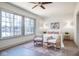Sun-filled bedroom featuring large windows, hardwood floors, and elegant decor at 5537 Broadway St, Indianapolis, IN 46220