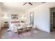 Spacious bedroom with neutral tones, hardwood floors, and ensuite bathroom access at 5537 Broadway St, Indianapolis, IN 46220