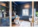 Elegant home office with custom built-ins, desk, and a cozy seating area at 5537 Broadway St, Indianapolis, IN 46220