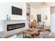 Elegant living room with fireplace, built-in shelving, and comfortable seating at 5537 Broadway St, Indianapolis, IN 46220
