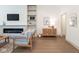 Bright living room with hardwood floors, a fireplace, and elegant decor at 5537 Broadway St, Indianapolis, IN 46220