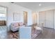 Cozy seating area with modern decor, hardwood floors, and a view into the kitchen at 5537 Broadway St, Indianapolis, IN 46220