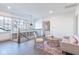 Bright upstairs loft area with hardwood floors, modern furniture, and large windows at 5537 Broadway St, Indianapolis, IN 46220