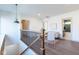 Inviting upstairs loft area with a staircase and stylish decor and hardwood floors at 5537 Broadway St, Indianapolis, IN 46220