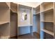 Organized walk-in closet featuring built-in shelving and a vanity area at 5537 Broadway St, Indianapolis, IN 46220