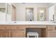 Bathroom vanity with double sinks, makeup vanity, and a bright countertop at 5721 Quail Crossing Dr, Indianapolis, IN 46237