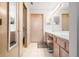 Bathroom featuring double sinks, a makeup vanity, and neutral-colored walls at 5721 Quail Crossing Dr, Indianapolis, IN 46237