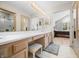 Ensuite bathroom view, with vanity, double sinks, and entryway into main bedroom at 5721 Quail Crossing Dr, Indianapolis, IN 46237