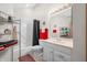 Well-lit bathroom features a shower, vanity, and shelving at 5721 Quail Crossing Dr, Indianapolis, IN 46237