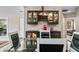 Well appointed dining area with bar and glass topped table with seating for four at 5721 Quail Crossing Dr, Indianapolis, IN 46237