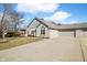 Charming single-story home with a well-maintained lawn and a spacious three-car garage at 5721 Quail Crossing Dr, Indianapolis, IN 46237