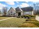 Exterior shot of the Villas at Quail Run Clubhouse with manicured lawn and blue skies at 5721 Quail Crossing Dr, Indianapolis, IN 46237