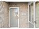 Close-up of a front door with brick surround and house number at 5721 Quail Crossing Dr, Indianapolis, IN 46237