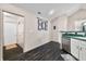 An open kitchen with nice countertops and views to a storage area at 5721 Quail Crossing Dr, Indianapolis, IN 46237