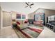 Comfortable living room with a fireplace, vaulted ceiling, and a large colorful rug at 5721 Quail Crossing Dr, Indianapolis, IN 46237