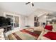 Spacious living room with vaulted ceilings, access to the patio, and an open layout at 5721 Quail Crossing Dr, Indianapolis, IN 46237