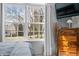 Close-up of bright window with view of neighboring houses and dresser at 5721 Quail Crossing Dr, Indianapolis, IN 46237