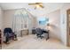 Bright office space showcases vaulted ceiling, ceiling fan, and a large window for lots of natural light at 5721 Quail Crossing Dr, Indianapolis, IN 46237