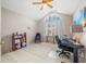 Inviting office space with vaulted ceiling, fan, large window, and ample room for desk and decor at 5721 Quail Crossing Dr, Indianapolis, IN 46237