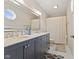 Bathroom features double sink vanity with white countertop and octagon window at 5732 Bold Ruler Dr, Indianapolis, IN 46237