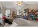 Bedroom with vaulted ceilings, ceiling fan, and windows providing natural light at 5732 Bold Ruler Dr, Indianapolis, IN 46237