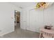 Bright bedroom featuring neutral walls, carpeted floor, a closet, and a play area at 5732 Bold Ruler Dr, Indianapolis, IN 46237