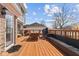 Spacious wooden deck featuring an outdoor dining table, a grill, and comfortable seating at 5732 Bold Ruler Dr, Indianapolis, IN 46237