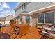 Inviting deck with a dining table, chairs, and a grill, ideal for outdoor gatherings at 5732 Bold Ruler Dr, Indianapolis, IN 46237