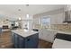Stylish kitchen with white cabinetry, quartz countertops, and a center island at 5732 Bold Ruler Dr, Indianapolis, IN 46237