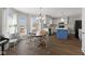 Eat-in kitchen features a dining table, island, and white cabinetry at 5732 Bold Ruler Dr, Indianapolis, IN 46237