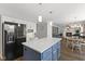 Well-appointed kitchen with a center island, open to the living and dining areas at 5732 Bold Ruler Dr, Indianapolis, IN 46237
