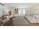 Bright living room with large sectional sofa, mounted television, and modern decor at 5732 Bold Ruler Dr, Indianapolis, IN 46237