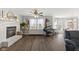 Cozy living room features a fireplace, piano, and backyard access at 5732 Bold Ruler Dr, Indianapolis, IN 46237