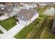 Aerial view of a home with a pond in a well-maintained neighborhood at 602 Tuscany Trl, Lapel, IN 46051