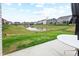 A backyard featuring a pond and nearby homes at 602 Tuscany Trl, Lapel, IN 46051