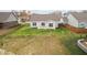 A spacious backyard, a small patio set, and a lush lawn at 602 Tuscany Trl, Lapel, IN 46051
