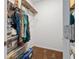 Walk-in closet with metal shelving and space for storage, clothes, and accessories at 602 Tuscany Trl, Lapel, IN 46051