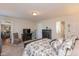 A Primary bedroom provides ample natural light, with an ensuite bathroom and sitting room visible at 6400 Woodland Ln, McCordsville, IN 46055