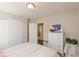A guest bedroom with a comfortable bed, white dresser, and closet space provides a welcoming atmosphere at 6400 Woodland Ln, McCordsville, IN 46055